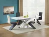 A dining room setting with a table and chairs. Voir les images du produit