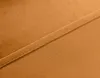 A close-up view of a seam on a piece of orange fabric. Produktbild-Vorschau
