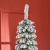 A close-up shot of the top section of a flocked artificial Christmas tree against a red background. Produktbild-Vorschau