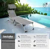 A lounge chair by a swimming pool with lush greenery and the ocean in the background. Náhled obrázku produktu