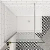 A top-down view of a modern shower enclosure with a white shower tray and patterned tiles. Produktbild-Vorschau