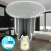 A bathroom drain stopper is shown in the foreground, with a blurred bathroom scene in the background. Produktbild-Vorschau