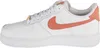 A side view of a white Nike Air Force 1 shoe with orange accents. Produktbild-Vorschau