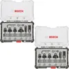 Two open Bosch router bit sets are displayed side-by-side against a white background. Podgląd zdjęcia produktu
