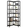A black, multi-tiered corner bookshelf with various decorative items on its shelves. Náhled obrázku produktu