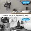 A split image showing a bathroom countertop before and after using a hairdryer wall mount. The top section shows the hairdryer mounted on the wall, with bottles and a sink on the counter. The bottom section shows a cluttered countertop with a hairdryer, br Produktbild-Vorschau