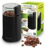 A coffee grinder and its packaging are shown, along with loose coffee beans. Podgląd zdjęcia produktu