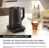A black electric kettle is shown on its base, next to a cup of tea and tea bags. Podgląd zdjęcia produktu