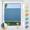A blue pleated blind is shown installed on a window, with a small vase of flowers on the windowsill below. Several circular swatches of different colored blinds are displayed on the right side of the image. Produktbild-Vorschau