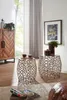 Two decorative side tables with intricate metal bases are placed in a living room setting, next to a wooden cabinet and a framed picture on the wall. Produktbild-Vorschau