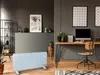 A modern living room or office space with a desk, computer, chair, and a heater. Produktbild-Vorschau