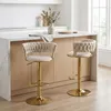 Two bar stools are placed at a kitchen island in a modern kitchen. Voir les images du produit