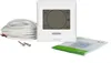 A white digital thermostat with a touchscreen display, a coiled white cable, and two screws, along with a folded instruction manual, are arranged on a white background. Náhled obrázku produktu