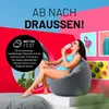 A woman in a bikini sits on a gray beanbag chair, eating an ice cream cone. The background is a vibrant collage of tropical plants and colorful artwork, with text overlays promoting outdoor use. Podgląd zdjęcia produktu