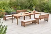 A wooden garden furniture set arranged on a patio with a garden in the background. Produktbild-Vorschau