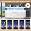 A white high-gloss sideboard with LED lighting, shown with a scenic background and app interface screenshots demonstrating features. Produktbild-Vorschau