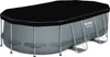 An oval-shaped swimming pool with a black cover, shown from a diagonal angle. Produktbild-Vorschau