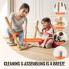 A mother and daughter are assembling a wooden table and chairs set. Voir les images du produit