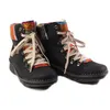 A pair of black boots with colorful woven accents and laces, shown against a white background. Anteprima dell’immagine prodotto
