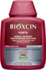 A close-up studio shot of a bottle of Bioxcin Forte Herbal Shampoo. Podgląd zdjęcia produktu