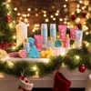 A collection of beauty and skincare products arranged on a mantelpiece decorated with Christmas garland and lights. Podgląd zdjęcia produktu
