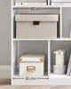 A white bookshelf with two storage boxes and a candle holder. Produktbild-Vorschau