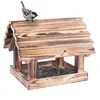 A wooden bird feeder filled with sunflower seeds, with a sparrow perched on top. Podgląd zdjęcia produktu