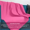 A pink fleece blanket draped over a blue sofa. Náhľad obrázku produktu