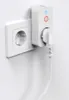 A white smart plug with two USB-A ports is plugged into a white wall socket. A white cable extends from the smart plug. Náhľad obrázku produktu