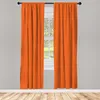 Two orange curtains hang on a window in a room with a wooden floor. Produktbild-Vorschau