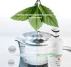 A water filter cartridge is shown next to a pitcher of water, with leaves and text indicating purification. Produktbild-Vorschau