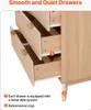 Close-up of the drawers of a wooden dresser, highlighting the slide system and legs. Voir les images du produit
