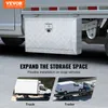A close-up of a silver truck tool box mounted on the side of a truck, with marketing text and smaller images of a truck and trailer below. Produktbild-Vorschau