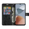 A black wallet-style phone case with a phone inserted, credit cards, and a banknote. Produktbild-Vorschau
