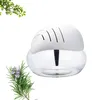 A white air purifier with a clear water reservoir sits on a white background, next to a sprig of rosemary and some green leaves. Produktbild-Vorschau