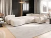 A modern living room with a large, U-shaped sectional sofa. Náhled obrázku produktu