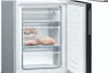 Close-up view of the inside of a refrigerator freezer compartment with food items. Anteprima dell’immagine prodotto