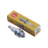 A spark plug and its packaging are displayed against a white background. Produktbild-Vorschau