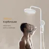 A man is showering under a modern white shower system. Anteprima dell’immagine prodotto