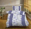 A neatly made bed with floral patterned bedding in a room. Produktbild-Vorschau