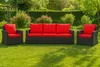 Outdoor furniture set with red cushions on a green lawn. Produktbild-Vorschau