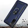 A blue phone case with a ring holder is shown in a dynamic, falling pose, with debris around it, suggesting durability. Produktbild-Vorschau