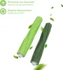 Two green vacuum cleaner brush rolls with green leaves floating around them. Podgląd zdjęcia produktu