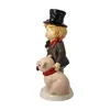 A figurine of a chimney sweep boy with a pig. Produktbild-Vorschau