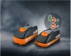 Two power tool batteries are displayed on a textured surface with a cloudy, dark background. A circular graphic overlay provides information about battery life and capacity. Produktbild-Vorschau