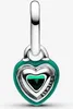 A close-up studio shot of a green heart-shaped charm with silver accents. Produktbild-Vorschau