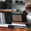 A collage of a Marshall speaker and other home decor items on shelves. Produktbild-Vorschau