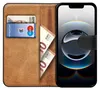 A book-style phone case open to reveal card slots and cash compartments, with a smartphone inserted. Podgląd zdjęcia produktu