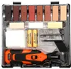 A kit for repairing wood surfaces, containing various colored repair sticks, a heating tool, batteries, and cleaning supplies, all neatly organized in a black plastic case. Náhled obrázku produktu