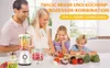 A family is preparing food in a kitchen, with a blender and food processor on the counter. Produktbild-Vorschau